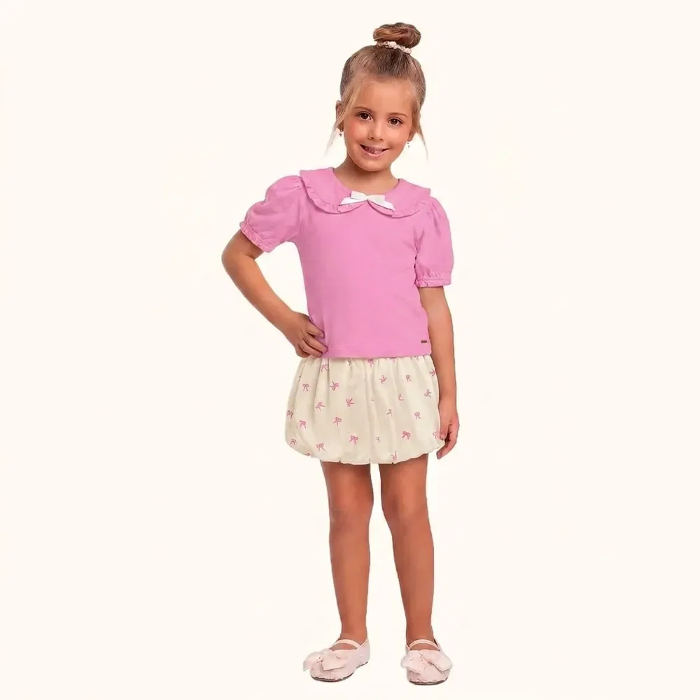 Conjunto blusa e short saia balonê com botão e laço decorativo — imagem 1